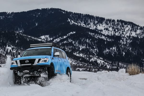 Blizzard Blue Nissan Armada Tows Track-Equipped Nissan 370Zki