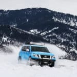Blizzard Blue Nissan Armada Tows Track-Equipped Nissan 370Zki