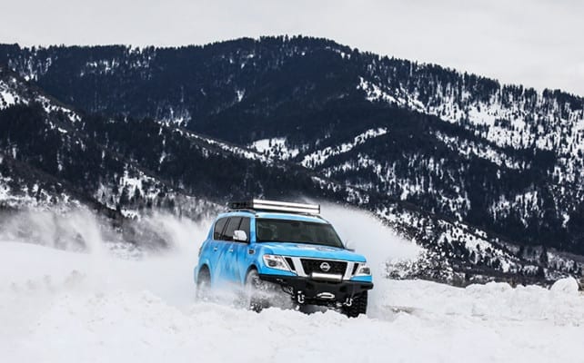 Blizzard Blue Nissan Armada Tows Track-Equipped Nissan 370Zki