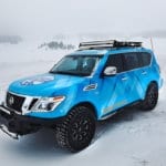 Blizzard Blue Nissan Armada Tows Track-Equipped Nissan 370Zki