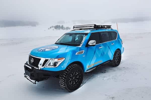 Blizzard Blue Nissan Armada Tows Track-Equipped Nissan 370Zki