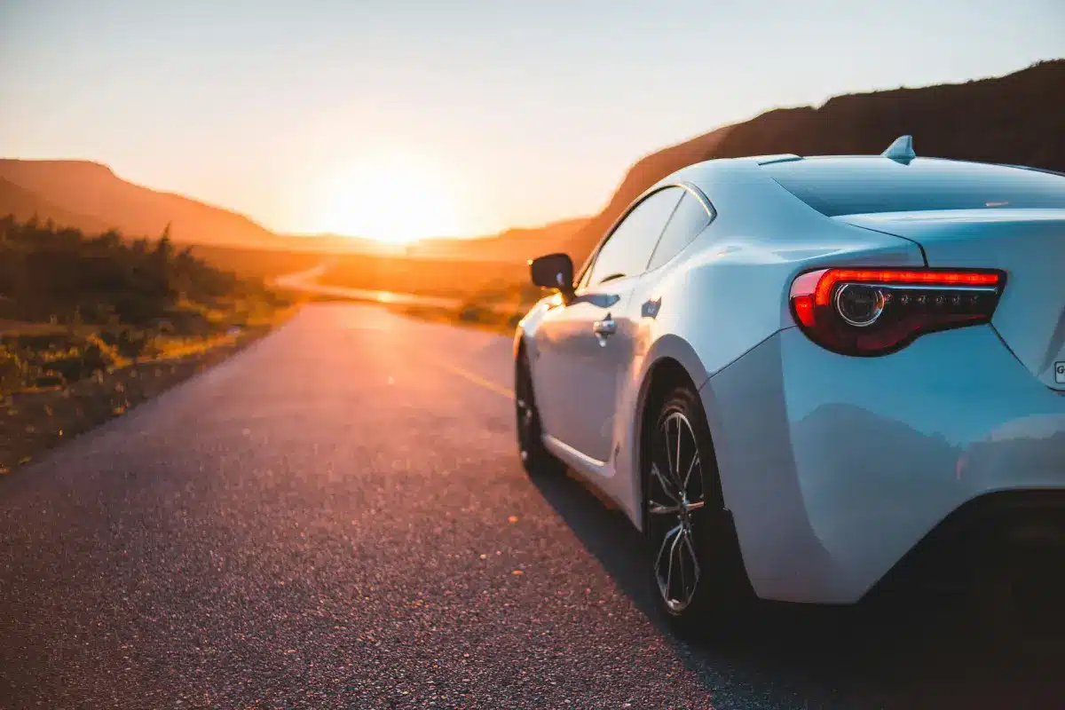 Sundown on a roadway. Photo Courtesy of Pexels: https://www.pexels.com/photo/luxury-car-on-asphalt-road-5054166/