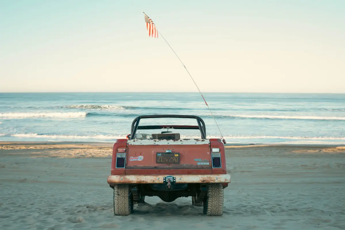 Jeepster on a beach on a Summer Road Trip. Photo Courtesy of Pexels: https://www.pexels.com/photo/vintage-jeep-on-a-california-beachfront-30241301/