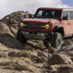 Preproduction model with available equipment shown. Available Summer 2022. Closed course. Professional Driver. Do not attempt unless you have special off-road driving training and are driving on a closed course. Always consult the owner’s manual before off-road driving, know your terrain and trail difficulty, and use appropriate safety gear. Ford is committed to the preservation of the environment and treading lightly. 2022 Bronco Raptor