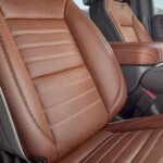 The Yukon Denali Ultimate features an Alpine Umber interior finished in full-grain leather with refined plaited contrast stitching. The 16-way power seats include massaging.