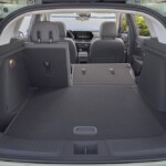 View from cargo space to front cabin with the right side and middle seat collapsed in Chevrolet Trax ACTIV in Cacti Green. Pre-production model shown. Actual production model may vary. Available in spring 2023. Cacti Green exterior color late availability.
