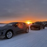 Coming off the handling course, the Jaguar I-Pace and F-Pace vehicles are prepping to head back to the lodge. JLR Ice Academy