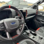 The orange strip on the steering wheel helps make it look cooler than a stock Ranger as well as helps you quickly identify if the wheel is straight. (Photo by Tim Esterdahl) 2024 Ford Ranger Raptor 13